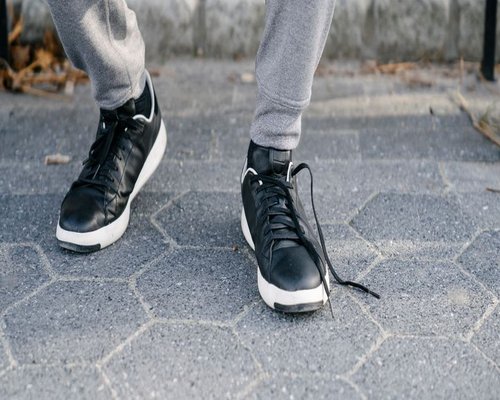 Person walking comfortably on a sidewalk